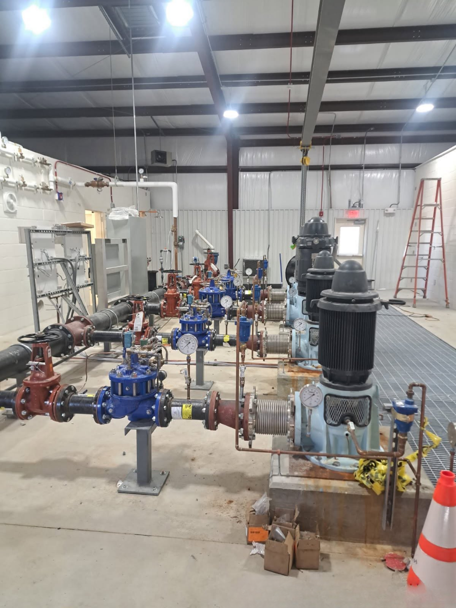 Interior pump station with pumps, valves, gauges and piping installed by EMS