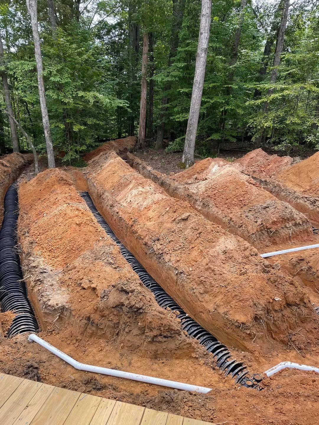 Chamber drainfield lines installed on a wooded residential lot